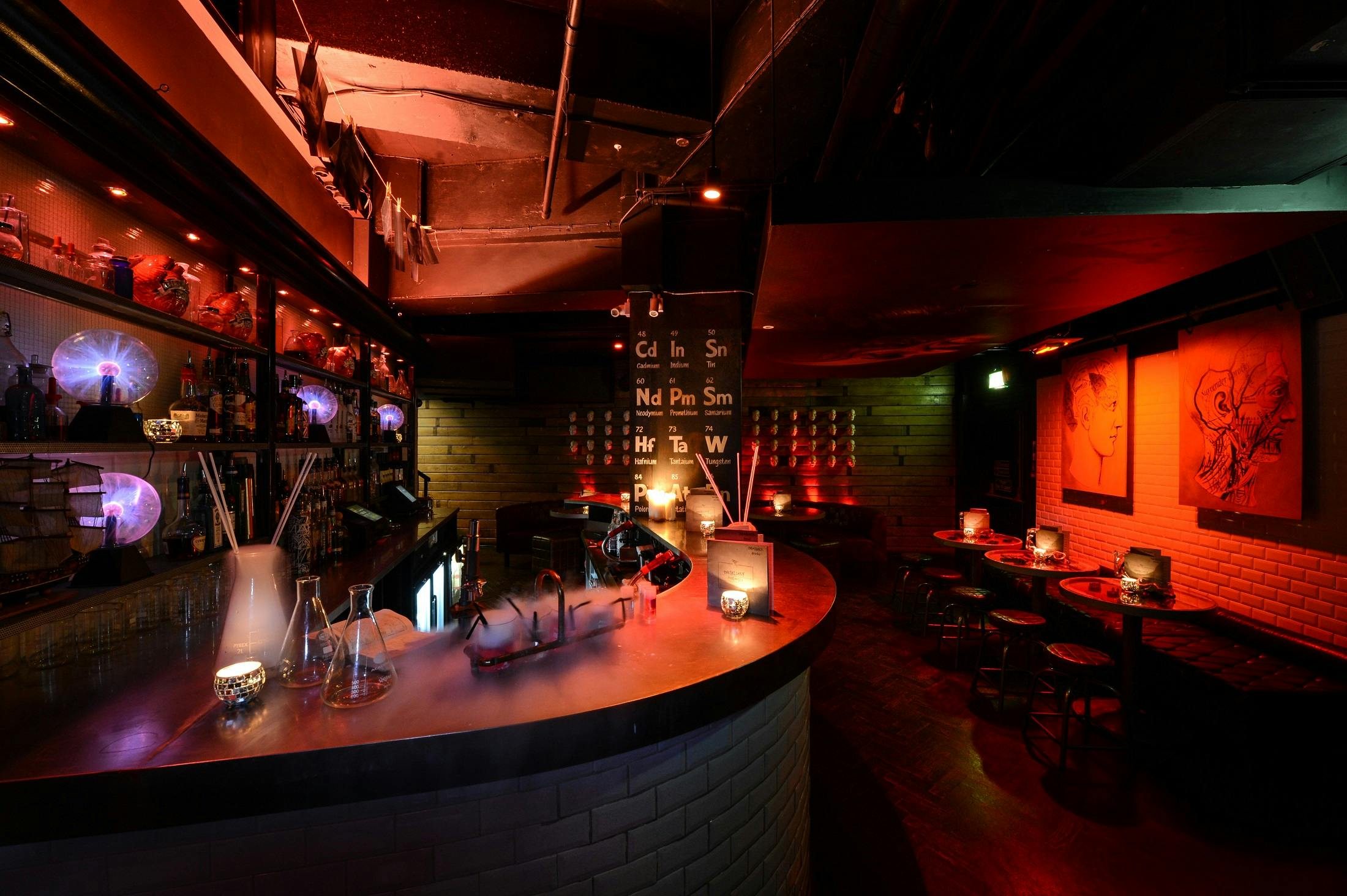 Stylish dimly lit bar at Piccadilly Institute for networking and intimate gatherings.